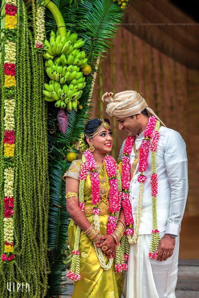 Portrait of an Indian bride posing with her husband in background Stock  Photo - Alamy